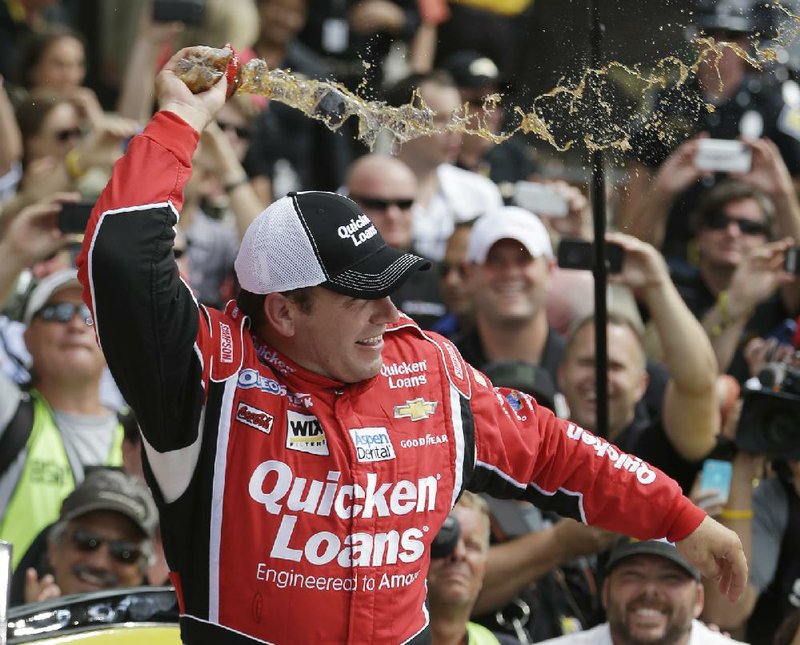 Sprint Cup Series driver Ryan Newman celebrates after winning the Brickyard 400 auto race at the Indianapolis Motor Speedway in Indianapolis, Sunday, July 28, 2013. (AP Photo/Darron Cummings)