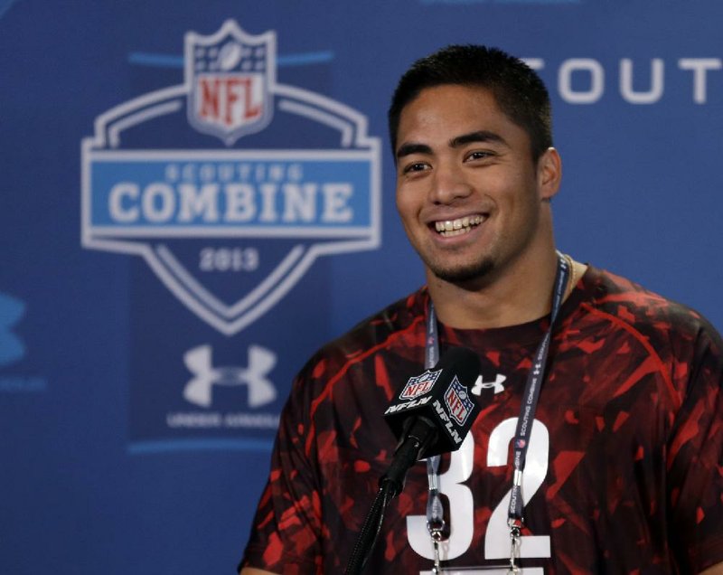 Notre Dame linebacker Manti Te'O answers a question during a news conference at the NFL football scouting combine in Indianapolis, Saturday, Feb. 23, 2013. (AP Photo/Michael Conroy)