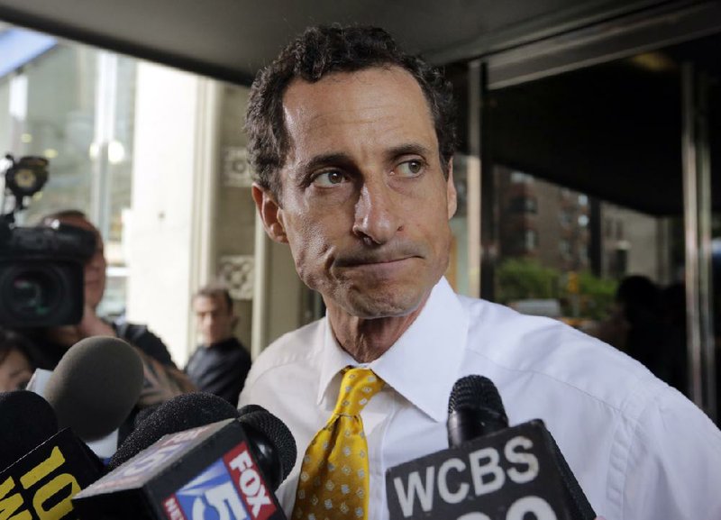 FILE — New York City mayoral candidate Anthony Weiner leaves his apartment building in New York on Wednesday, July 24, 2013. (AP Photo/Richard Drew, File)
