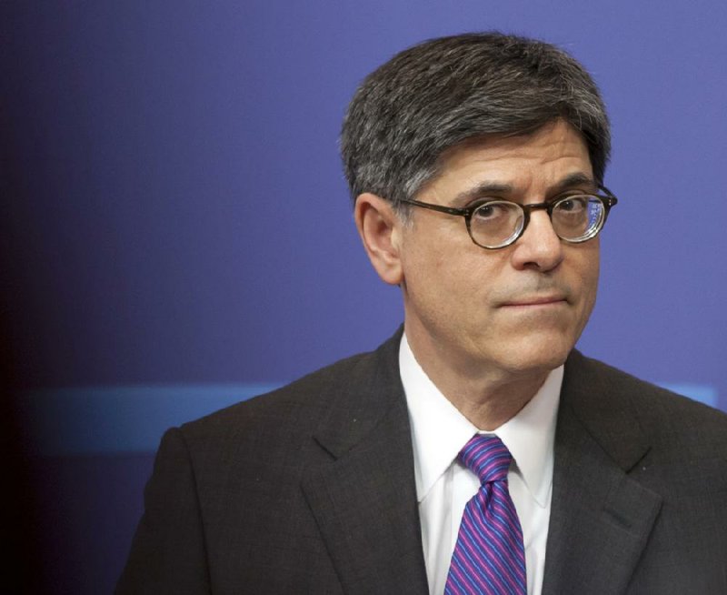 FILE - In this April 8, 2013, file photo U.S. Treasury Secretary Jacob Lew listens to a question during a media conference at EU headquarters in Brussels. Congress needs to raise the debt limit and take away the "cloud of uncertainty" about the nation's ability to pay its bills, Lew said in an interview broadcast Sunday, July 28, 2013. "The fight over the debt limit in 2011 hurt the economy... Congress needs to do its job. It needs to finish its work on appropriation bills. It needs to pass a debt limit," he said. (AP Photo/Virginia Mayo File)