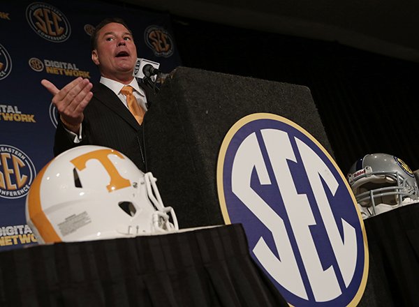 Tennessee coach Butch Jones talks with reporters during the Southeastern Conference football Media Days in Hoover, Ala., Wednesday, July 17, 2013. (AP Photo/Dave Martin)