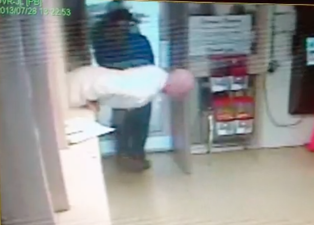 Derrick Estell is seen climbing through a window at the Garland County jail in this surveillance image released after the 2013 escape.  