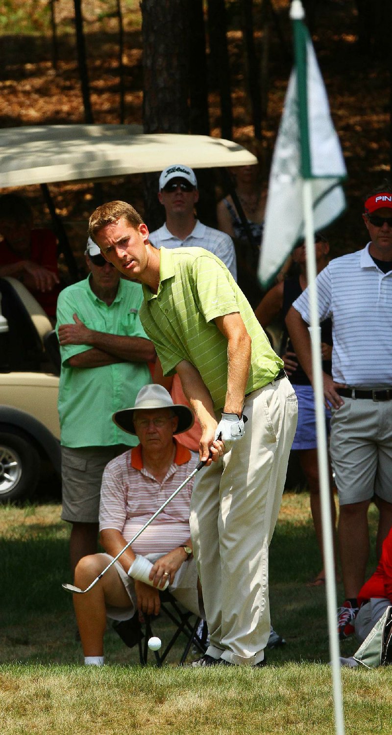 7/21/12...Arkansas Democrat-Gazette/STEPHEN B. THORNTON...
Peter Williamson chips onto the green after hitting his ball right at the fan's base on the edge of the green during Saturday afternoon's 106th Southern Amateur Golf Championship being held at Chenal Country Club in Little Rock. 