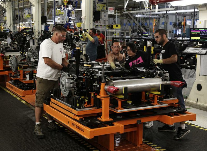 Line workers assemble the rear suspension of a Jeep Cherokee at a Chrysler assembly complex in Toledo, Ohio, on July 18. In the second quarter, Chrysler sold 643,000 vehicles worldwide, a 10 percent increase from a year ago. 