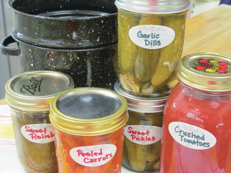 A garden’s bounty can be saved from spoilage by pickling and preserving. Both quick pickling and longer lasting water-bath canning take extra cucumbers, tomatoes, okra, onions and squash and allow their garden fresh flavors to be enjoyed throughout the year.