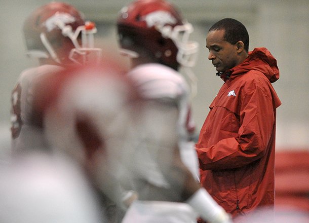 Arkansas linebackers coach Randy Shannon watches during a spring practice in Fayetteville. 