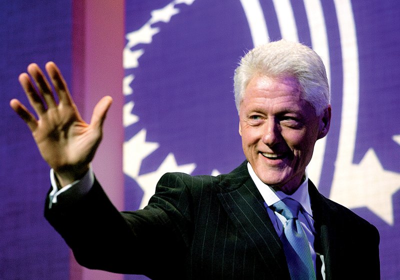 Former U.S. President Bill Clinton waves to the audience as he opens the Clinton Global Initiative, Sunday, Sept. 23, 2012, in New York. 