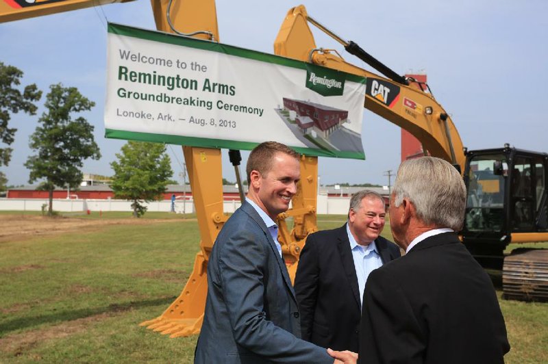 Arkansas Democrat-Gazette/RICK MCFARLAND --08/08/13--   Gov. Mike Beebe is greeted by Kevin Miniard(left), chief operating officer, and Jim Grahlmann, plant manager, for the Remington Ammunition Plant in Lonoke during a groundbreaking ceremony Thursday for the plant's expansion. 