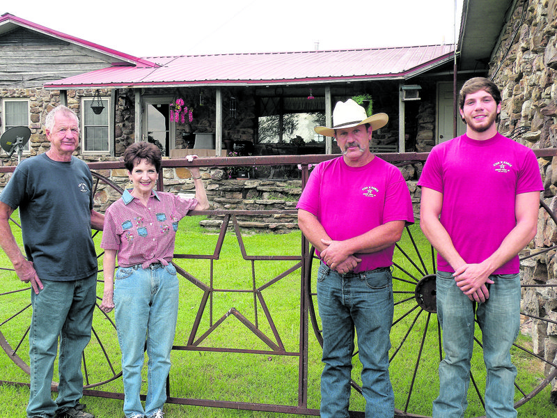 The Bill Hunt family of Greers Ferry is the 2013 Cleburne County Farm Family of the Year. Family members include, from the left, Bill and his wife, Shelby; their son, John Hunt; and their grandson, Aaron Hunt.