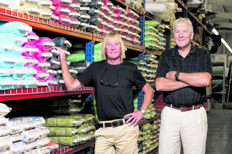 Marshall, left, and Larry Bentley of Batesville are owners of Marshall Dry Goods Company, which has been in operation in Batesville since 1944.