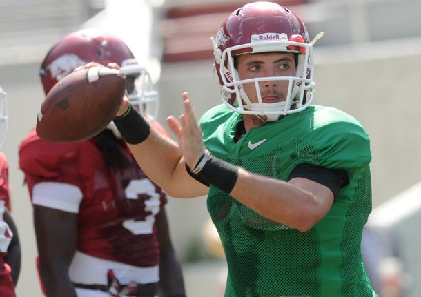 Arkansas quarterback Brandon Allen warms up before a scrimmage Saturday at Donald W. Reynolds Razorback Stadium in Fayetteville.