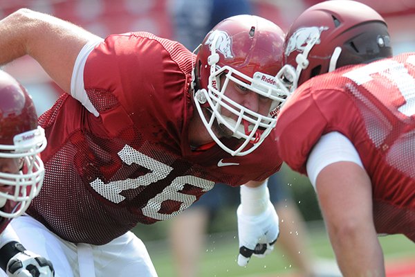  University of Arkansas lineman Dan Skipper runs drills before Saturday afternoons scrimmage at Razorback Stadium in Fayetteville.