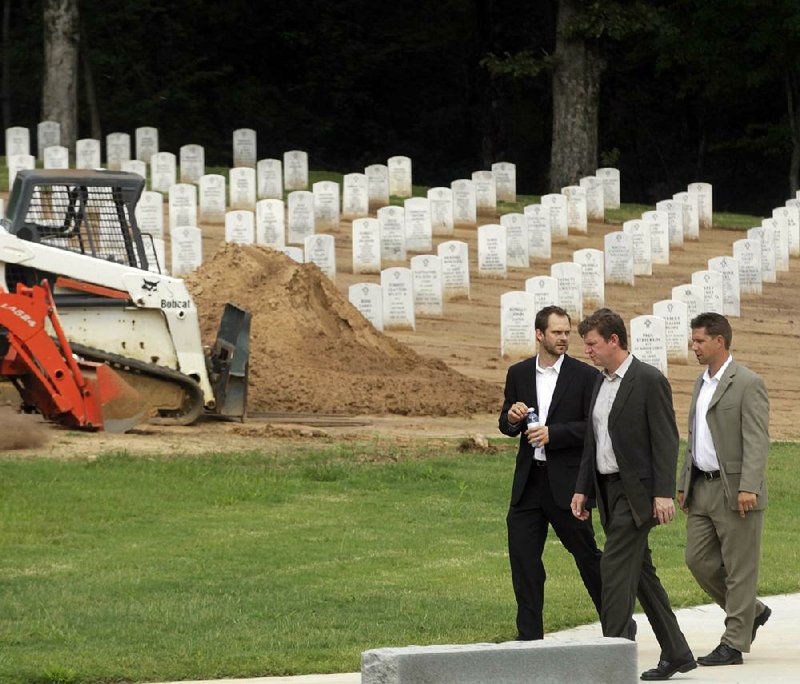 Arkansas Democrat-Gazette/BENJAMIN KRAIN --8/12/2013--
Ecological Design Group landscape architects and engineers, Brahm Driver, Martin Smith and Tanner Weeks tour Arkansas State Veterans Cemetary in North Little Rock on Monday after a ceremony announcing the award of $4.4 million in grant funding to the Arkansas Department of Veterans Affairs to develop nine acres for an expansion project.