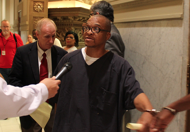 Darrell Dennis asserts his innocence to reporters after a hearing Tuesday in which he entered an innocent plea.