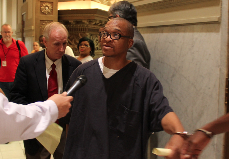 Darrell Dennis asserts his innocence to reporters after a hearing Tuesday in which he entered an innocent plea.