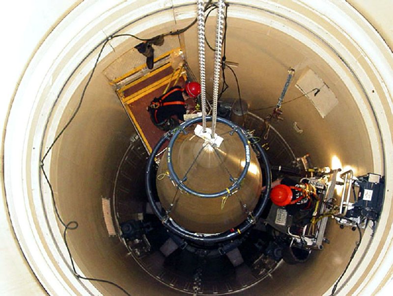 A missile maintenance team removes part of an ICBM at a Montana missile site recently. A unit at Malmstrom Air Force Base, Mont., failed a safety inspection recently, joining another missile base that received a bad review earlier this year. 