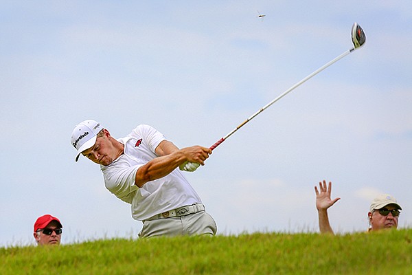 Arkansas Razorback Sebastian Cappelen tees off of second hole during a playoff in his match play against Robby Shelton during the Western Amateur at the Alotian Club in Roland. 