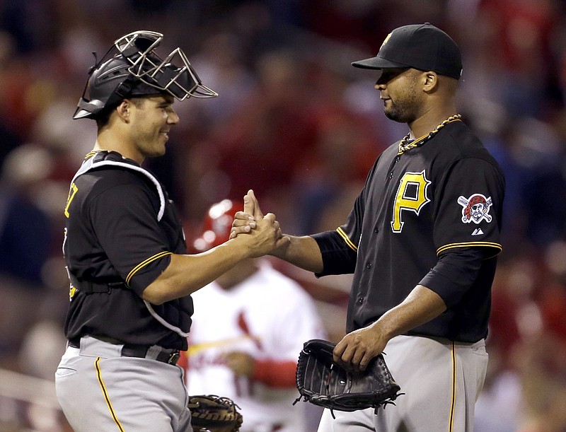 Pittsburgh Pirates pitcher Francisco Liriano (right) is congratulated by catcher Tony Sanchez after his complete-game four-hitter in Wednesday night’s 5-1 victory over the St. Louis Cardinals. Liriano retired the Cardinals in order six times. 