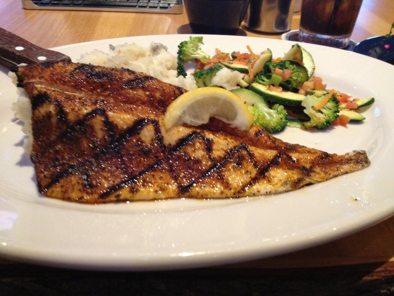 Twin Peaks’ Trophy Trout comes with a pile of mashed potatoes and a side of sauteed vegetables. 