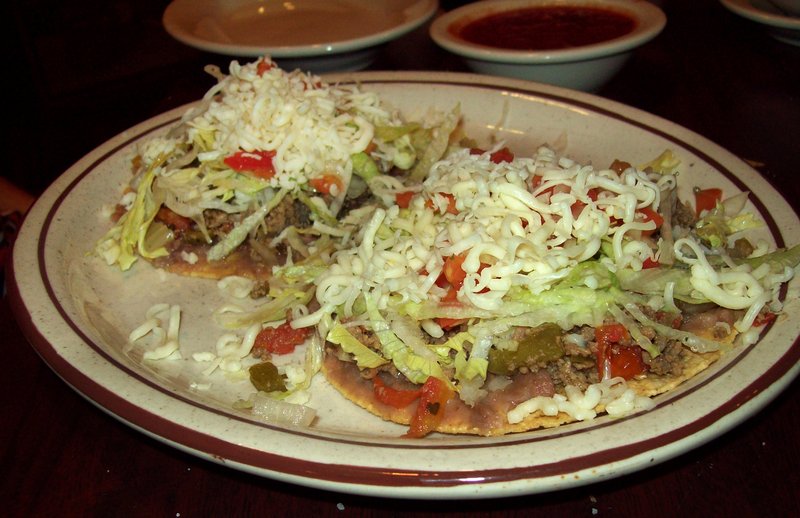 Beef tostadas are topped with cheese, lettuce, onions and peppers at Cotija’s Mexican Grill’s second downtown Little Rock location in the Legacy Hotel. 