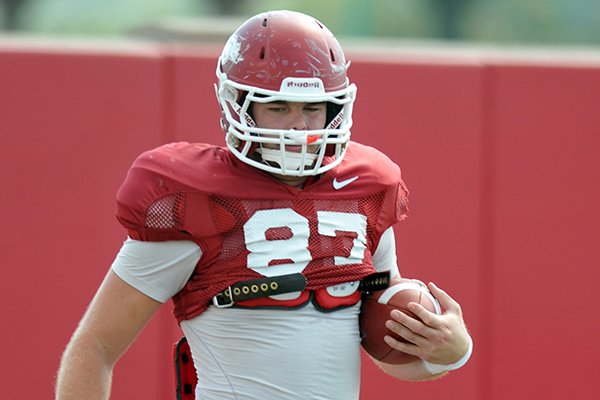 Arkansas tight end Austin Tate works out during a 2012 practice in Fayetteville. 