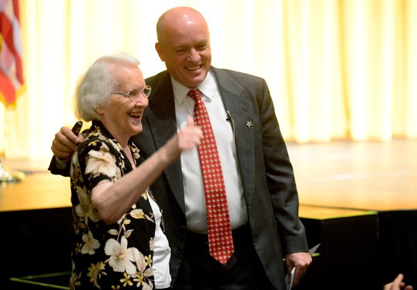 Bentonville School Superintendent Michael Poore talks with Mary Mae Jones on Friday, Aug. 16, 2013, inside the Arend Arts Center at the high school in Bentonville. The district held a back-to-school celebration for faculty members. Students return to classes on Monday to start the new school year.