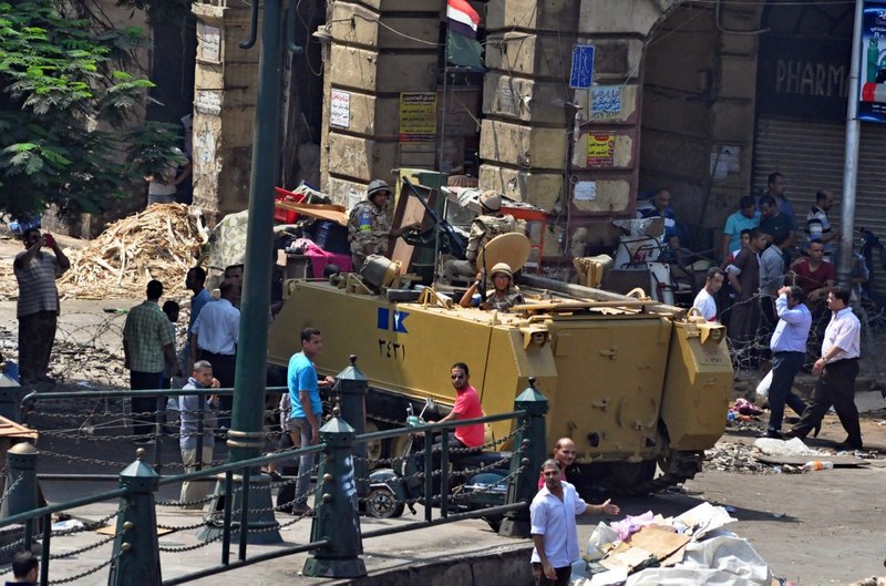 Egyptians Army forces stand guard outside the al-Fatah mosque in downtown Cairo, Egypt on Saturday, Aug. 17 after hundreds of Islamist protesters barricaded themselves inside the mosque overnight. (AP Photo/Hussein Tallal)