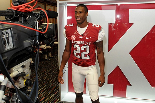 Arkansas cornerback D.J. Dean speaks with reporters during the Razorbacks' media day on Aug. 11, 2013 in Fayetteville. 