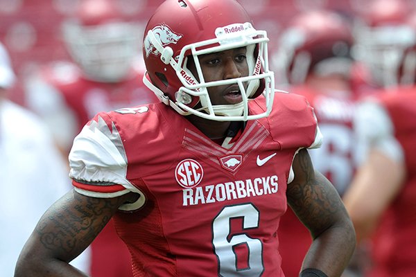 Arkansas receiver D'Arthur Cowan watches warmups prior to the Razorbacks' Red-White game on April 20, 2013 in Fayetteville. 