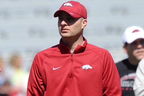 Arkansas tight ends coach Barry Lunney Jr. watches practice on April 6, 2013 at Razorback Stadium in Fayetteville. 