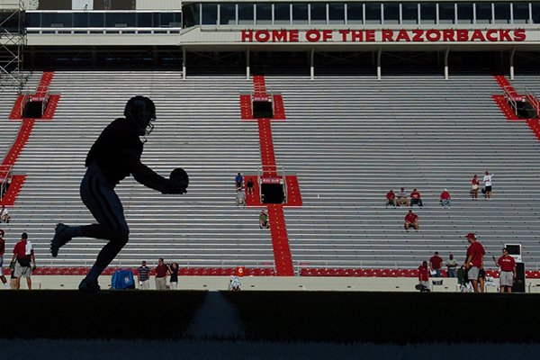 A player runs drills at Razorback Stadium in Fayetteville. 