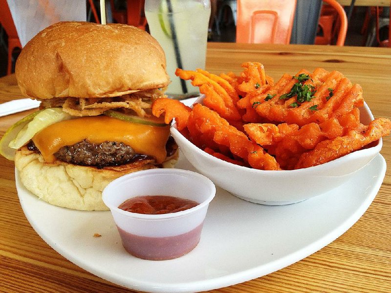 Big Orange Midtown’s Hickory Smoke burger piles high; we got ours with a la carte Sweet Potato Fries and Mango-Curry Ketchup. 