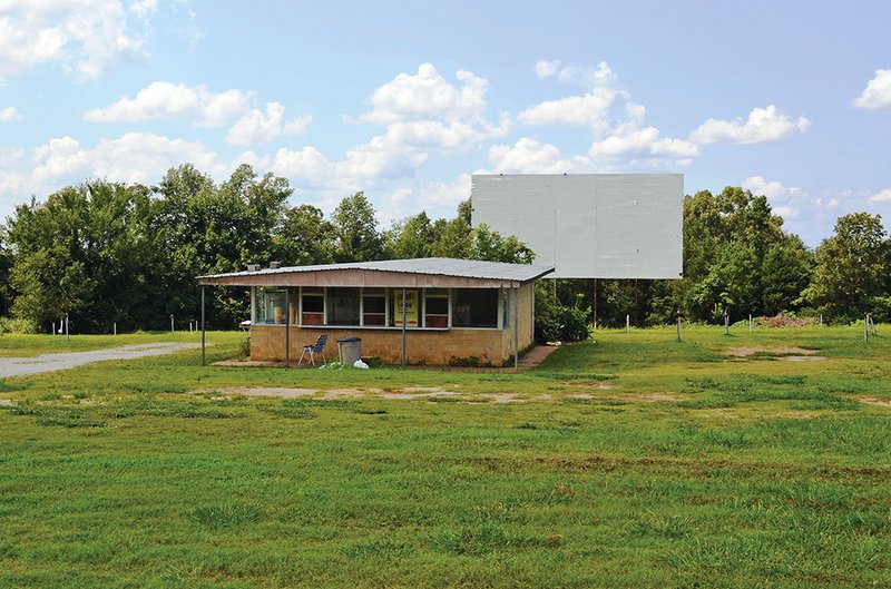 The Stone Drive-In Theater in Mountain View, the only remaining drive-in theater in the state still using 35mm film, is in danger of closing unless the owner can raise the money to purchase a digital projector. The projection/concession building is pictured, with the screen in the background.