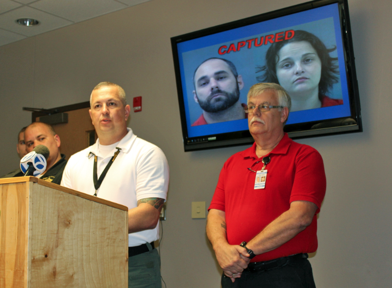 Garland County sheriff's office Sgt. Joel Ware, left, speaks at a news conference Friday about the arrests of escapee Derrick Estell and Tamara Upshaw, who's accused of assisting Estell.