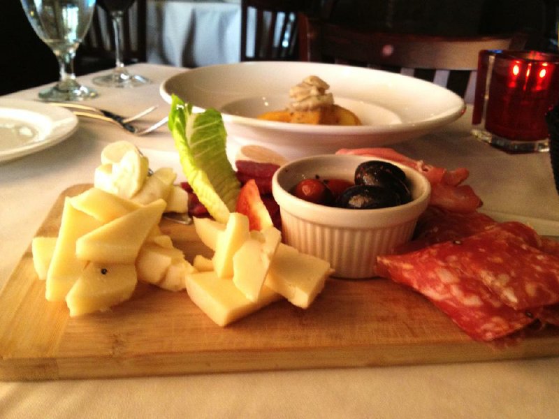The Chef’s Choice Antipasto — three meats, three cheeses and a plate of assorted olives — carries a pretty high price tag. 