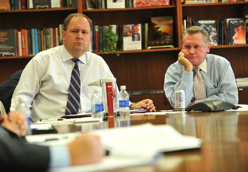 University of Arkansas chief fundraiser Chris Wyrick expressed regrets this week about remarks he made that a fired university spokesman found offensive. Wyrick (left) is shown with UA Chancellor G. David Gearhart.