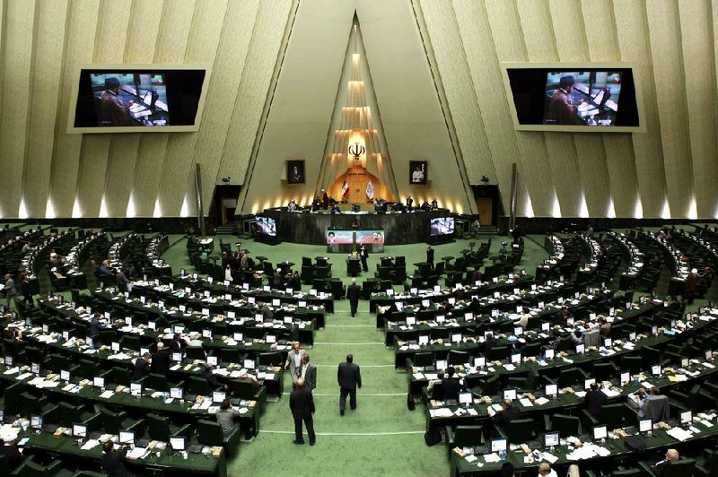 Government officials gather in Iran’s parliament chamber in Tehran this week. The U.S. hopes economic pressure from sanctions will force Iran to compromise on its nuclear program. 