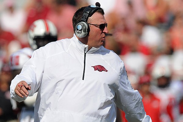 Bret Bielema, Arkansas head coach, looks back to the field after checking on one of his injured players Saturday, Aug. 31, 2013 during the first quarter of the game against Louisiana at Donald W. Reynolds Razorback Stadium in Fayetteville.