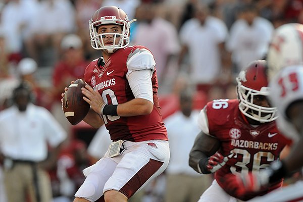 Brandon Allen checks for receivers downfield Saturday, Aug. 31, 2013 during the fourth quarter of the game against Louisiana at Donald W. Reynolds Razorback Stadium in Fayetteville.