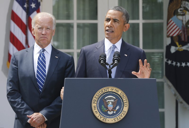 President Barack Obama stands with Vice President Joe Biden as he makes a statement about Syria in the Rose Garden at the White House in Washington, on Saturday, Aug. 31. Obama said he has decided that the United States should take military action against Syria in response to a deadly chemical weapons attack, and said he will seek congressional authorization for the use of force. (AP Photo/Charles Dharapak)