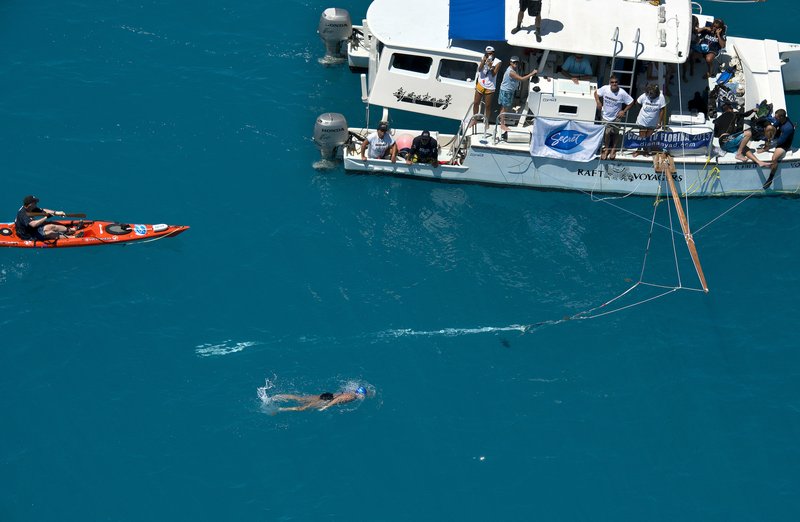 In this photo provided by the Florida Keys News Bureau, Diana Nyad, positioned about two miles off Key West, Fla., Monday, Sept. 2, 2013, swims towards the completion of her approximately 110-mile trek from Cuba to the Florida Keys. Nyad, 64, is the first swimmer to cross the Florida Straits without the security of a shark cage.