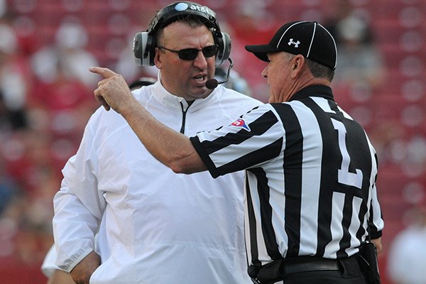 Arkansas coach Bret Bielema talks with an official during the fourth quarter of the Razorbacks' 34-14 win over Louisiana-Lafayette on Saturday, Aug. 31, 2013 at Razorback Stadium in Fayetteville. 