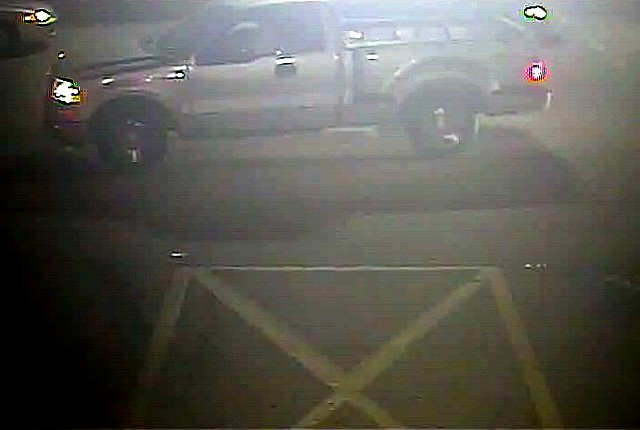 An image from a surveillance camera video of a truck being sought by police in connection with a triple shooting at Y Liquor in Springdale.