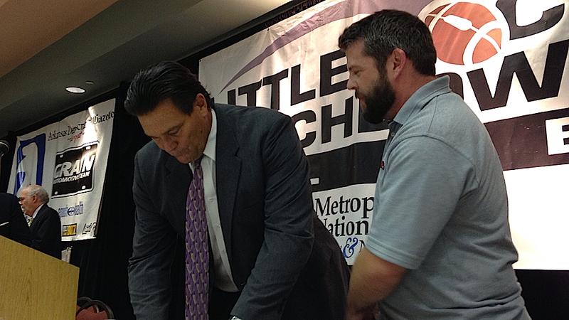 Former Arkansas Razorback and NFL Hall of Famer Dan Hampton (left) signs autographs for fans after his address of the Little Rock Touchdown Club on Tuesday, Sept. 3, 2013. 
