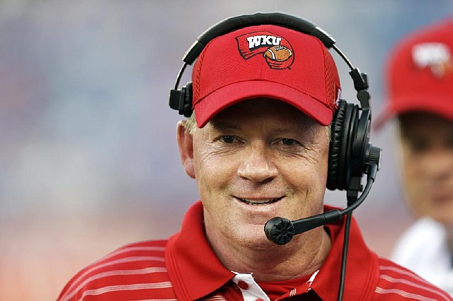 Western Kentucky head coach Bobby Petrino watches from the sideline in the first quarter of an NCAA college football game against Kentucky on Saturday, Aug. 31, 2013, in Nashville, Tenn. (AP Photo/Mark Humphrey)
