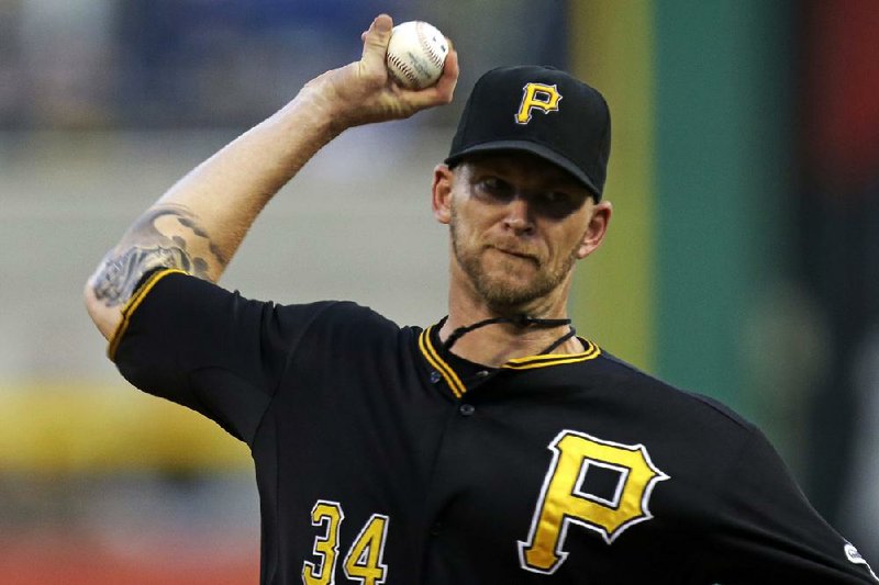 Pittsburgh Pirates starting pitcher A.J. Burnett (34), a Little Rock native, delivers during the first inning of a baseball game against the St. Louis Cardinals in Pittsburgh Saturday, Aug. 31. Burnett reportedly agreed to a 1-year, $16 million deal on Wednesday morning.