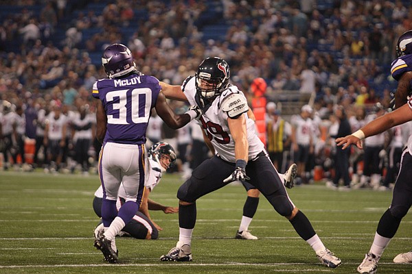 Former Rogers High player Jake Byrne blocks a Minnesota player while playing for the Texans during an NFL preseason game earlier this year. Byrne spent the preseason with the Texans but is now on the San Diego roster.