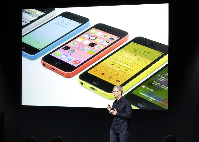 Tim Cook, chief executive officer of Apple Inc., describes the new iPhone 5C on Tuesday at a product-introduction event in Cupertino, Calif. 