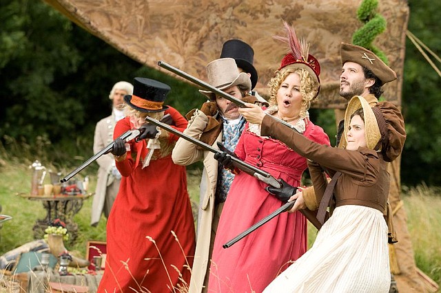 They aim to please at Austenland, the fictional British theme resort for which Jerusha Hess’ new comedy takes its name. On the firing line (from left) are: Lady Amelia Heartwright (Georgia King), Colonel Andrews (James Callis), Lady Elizabeth Charming (Jennifer Coolidge), Martin (Bret McKenzie) and Jane Hayes (Keri Russell). 