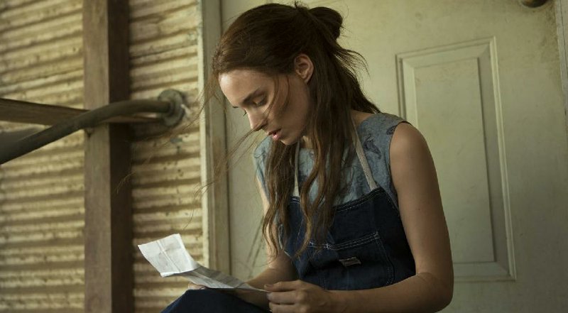 Ruth Guthrie (Rooney Mara) receives a letter from her imprisoned lover in Ain’t Them Bodies Saints. 